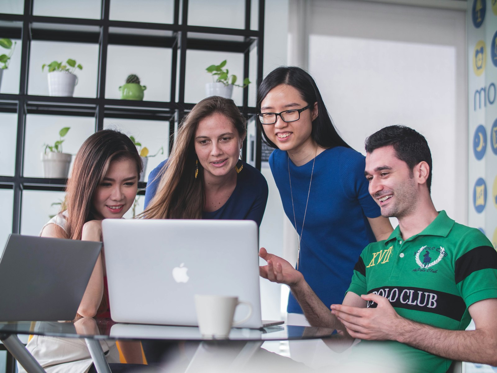 A group of students collaborating in a campus workspace