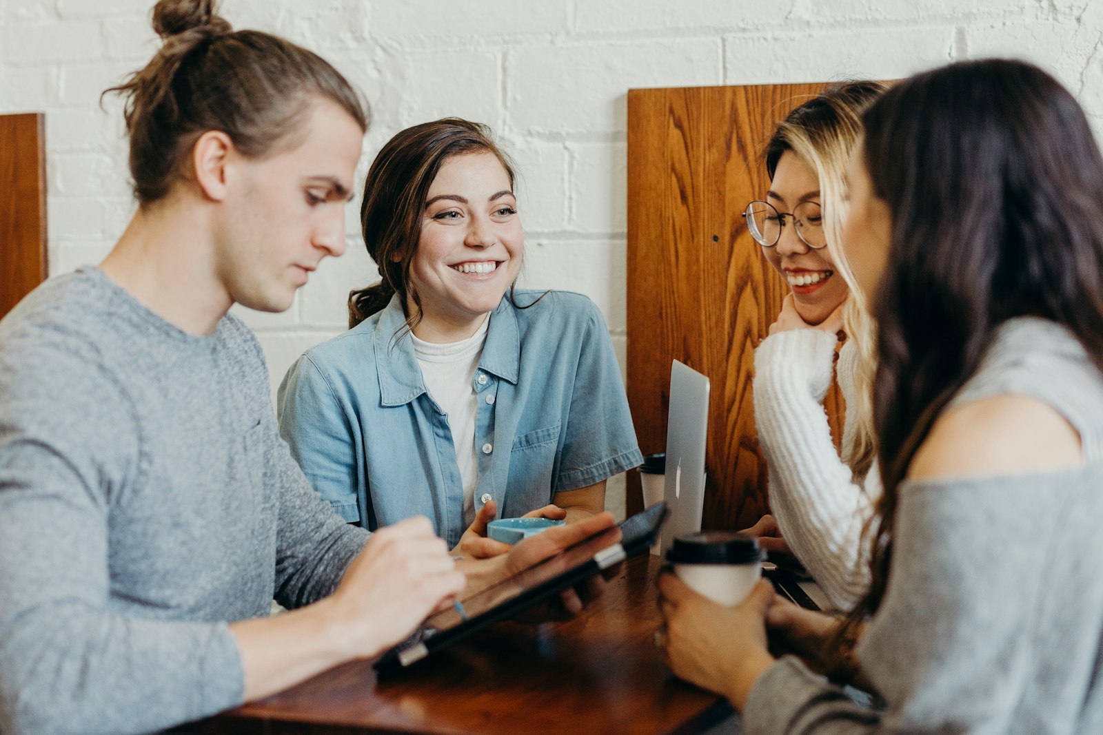Students working together at a table on campus